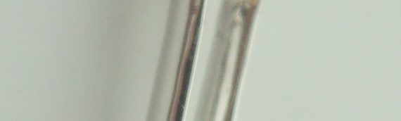 9ct white gold diamond pendent and chain, with a 18 inch trace link 9ct gold chain – Total diamonds – 10pts